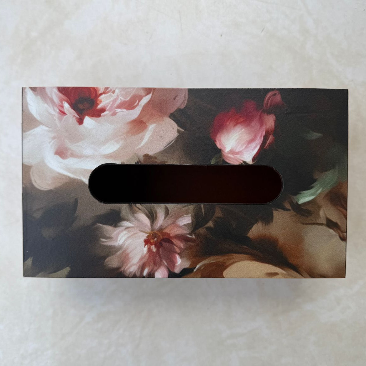 Floral-patterned box on a textured surface