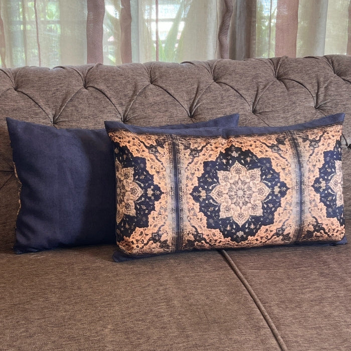 Decorative pillows on a brown sofa with curtains in the background