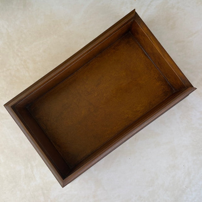 Wooden box inside view on a textured surface