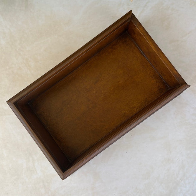 Inside view of wooden box on a textured surface