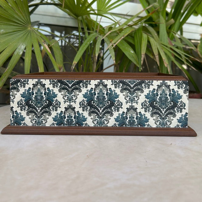 Rectangular box with blue pattern on a wooden base