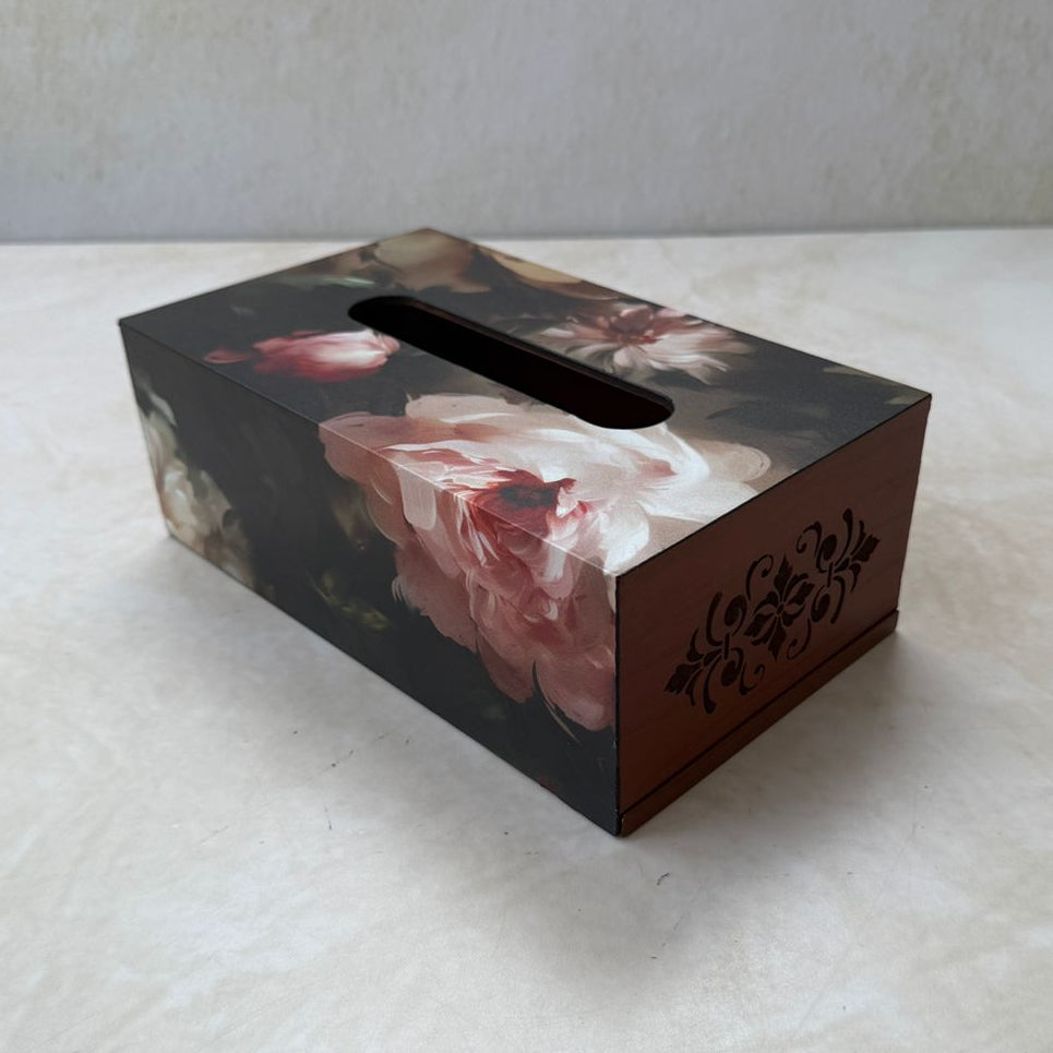 Floral-patterned tissue box on a white surface with a light background