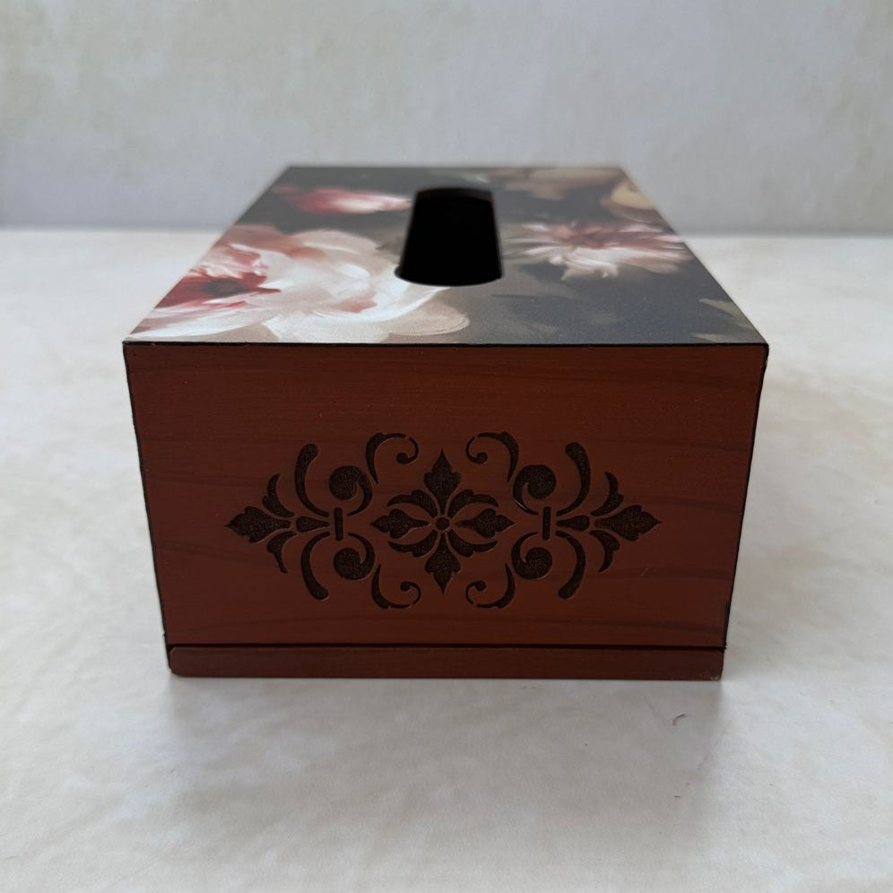 Wooden tissue box with intricate carving and floral design on a white surface