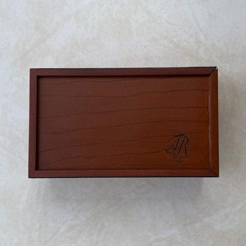 Bottom view of wooden tissue box on a textured white background