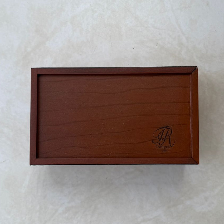 Bottom view of wooden tissue box on a beige textured background