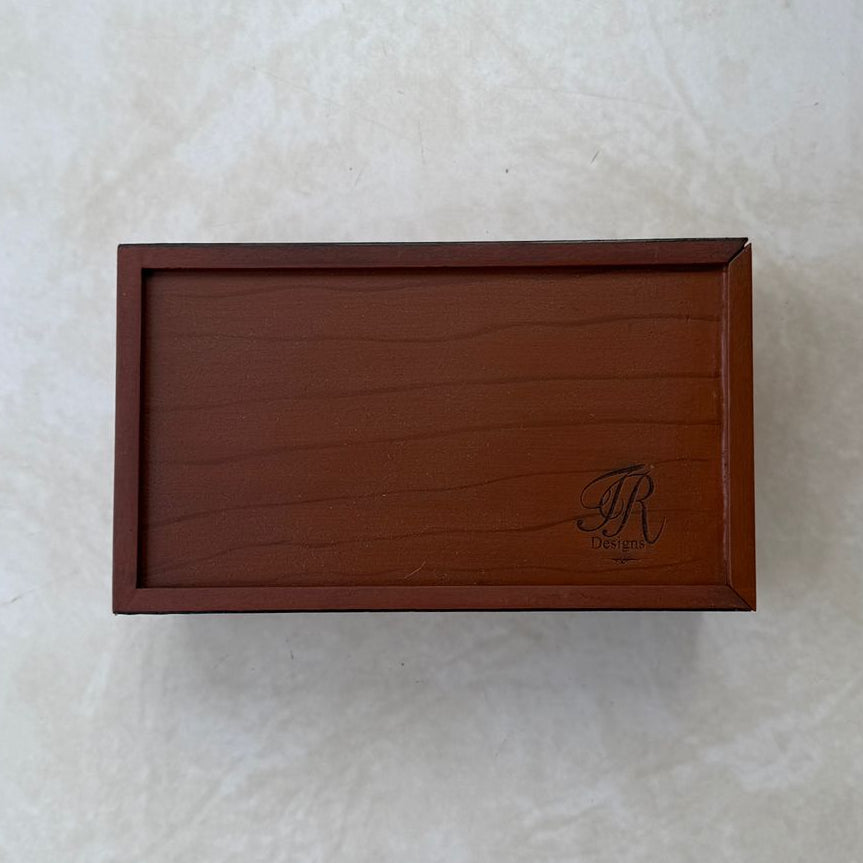Bottom view of wooden tissue box on a textured white background