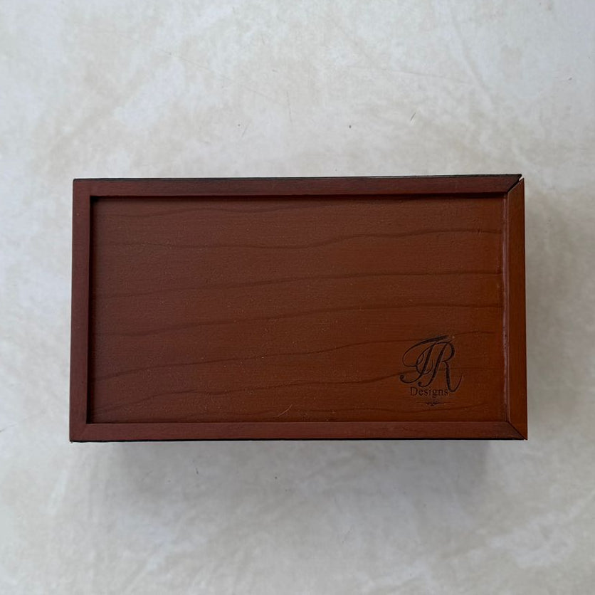 Bottom view of wooden tissue box on a beige textured background