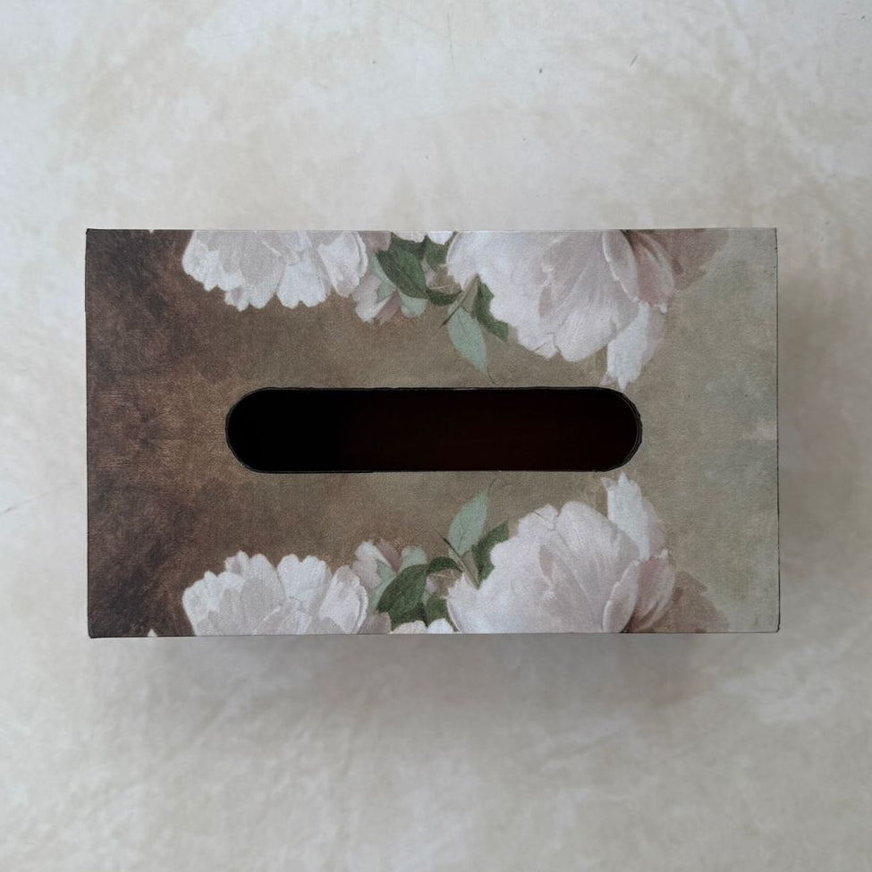 Tissue box cover with floral design on a textured surface