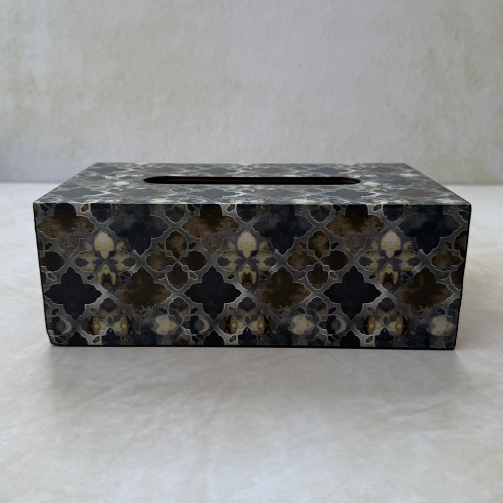 Decorative tissue box cover with geometric pattern on a white surface